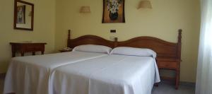 Łóżko lub łóżka w pokoju w obiekcie Hotel La Costera