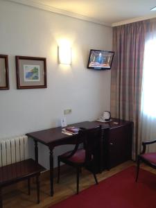 TV a/nebo společenská místnost v ubytování Hostal Navarra