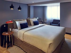 Cama ou camas em um quarto em Grand Mercure Brasilia Eixo Monumental