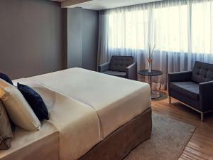 Кровать или кровати в номере Grand Mercure Brasilia Eixo Monumental