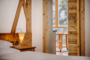 Postel nebo postele na pokoji v ubytování Hotel Garni Elisir