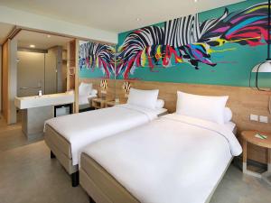 Voodi või voodid majutusasutuse Ibis Styles Bogor Raya toas