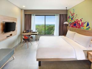 Voodi või voodid majutusasutuse Ibis Styles Bogor Raya toas