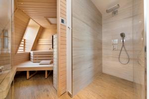 a bathroom with a sauna with a shower at Villa Strandblick 8 in Zingst +23 photos