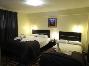 Ένα ή περισσότερα κρεβάτια σε δωμάτιο στο Hostal Samichay