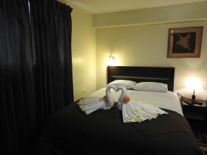 Ένα ή περισσότερα κρεβάτια σε δωμάτιο στο Hostal Samichay
