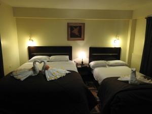 Ένα ή περισσότερα κρεβάτια σε δωμάτιο στο Hostal Samichay
