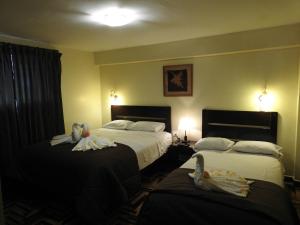 Ένα ή περισσότερα κρεβάτια σε δωμάτιο στο Hostal Samichay