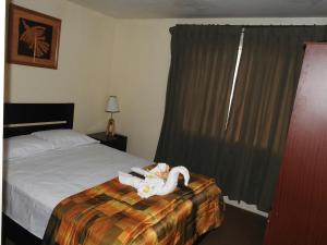 Ένα ή περισσότερα κρεβάτια σε δωμάτιο στο Hostal Samichay