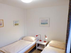Ein Bett oder Betten in einem Zimmer der Unterkunft Ferienwohnung *Wibkes Hüs*