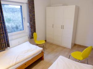 Ein Bett oder Betten in einem Zimmer der Unterkunft Ferienwohnung *Wibkes Hüs*
