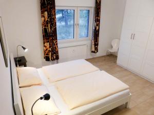 Ein Bett oder Betten in einem Zimmer der Unterkunft Ferienwohnung *Wibkes Hüs*