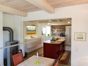 a large kitchen with a table and a stove at Ruard Waanang in Nebel