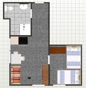 a floor plan of a bathroom with two chairs at Hüs Sanskiin Ferienwohnung *Eerdglüper* in Süddorf