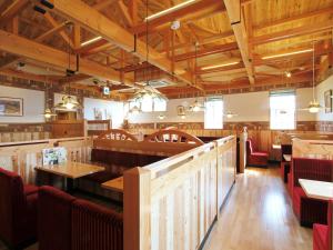 a dining room with wooden tables and chairs at APA Hotel Shibuya Dogenzakaue in Tokyo