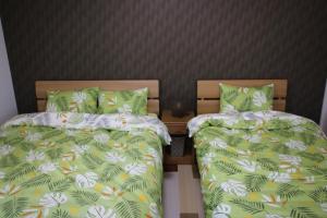 Postel nebo postele na pokoji v ubytování guesthouse yu -SEVEN Hotels and Resorts-