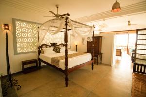 Letto o letti in una camera di Little Tamarind