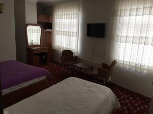 Postel nebo postele na pokoji v ubytování Hotel Birkent + 37 fotografií