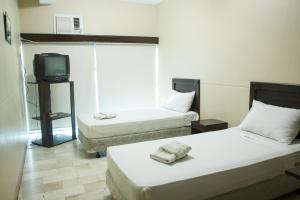 Postel nebo postele na pokoji v ubytování GV Hotel - Valencia