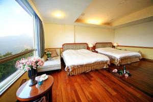 Postel nebo postele na pokoji v ubytování Dream Forest Villa