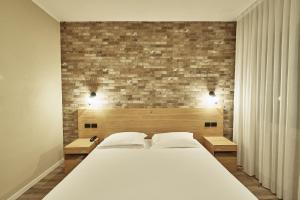 Postel nebo postele na pokoji v ubytování Hotel Miramonti