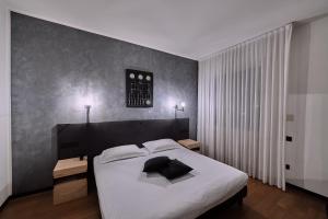Postel nebo postele na pokoji v ubytování Hotel Miramonti