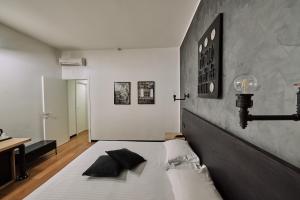 Postel nebo postele na pokoji v ubytování Hotel Miramonti