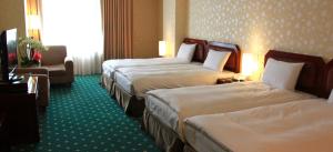 Katil atau katil-katil dalam bilik di 柳營尖山埤 Liuying Jianshanpi Resort