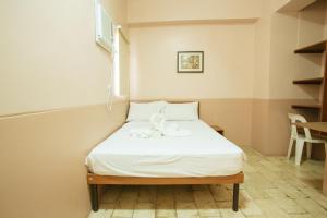 Postel nebo postele na pokoji v ubytování GV Hotel - Tagbilaran City