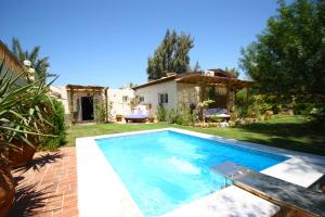 a swimming pool in the backyard of a house at Deluxe Seahorse Apartment - Lagoon Villa in Dahab