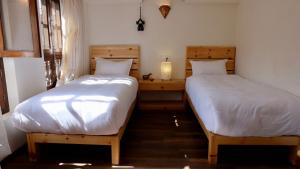 Hotel Timila客房内的一张或多张床位