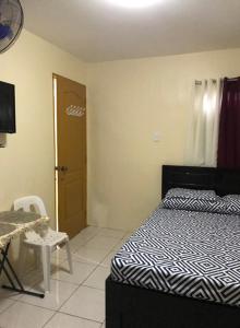 A bed or beds in a room at RV3 TRANSIENT HOUSE
