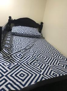 A bed or beds in a room at RV3 TRANSIENT HOUSE