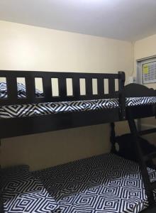 A bed or beds in a room at RV3 TRANSIENT HOUSE
