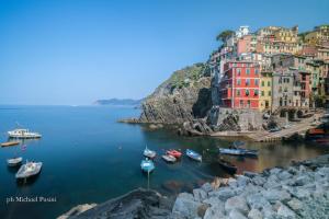 a view of a town with boats in the water at donadelmar2 in Riomaggiore