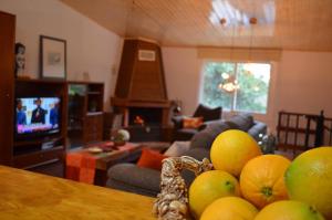 a living room with a bunch of fruit on a table at casa Francelos in Rois