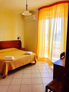 Voodi või voodid majutusasutuse Hotel Ristorante La Decanata toas