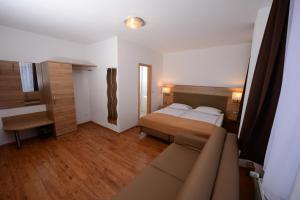 Ένα ή περισσότερα κρεβάτια σε δωμάτιο στο Hotel Linde Stuttgart - Self Check-In