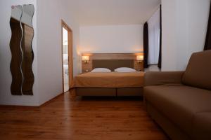 Ένα ή περισσότερα κρεβάτια σε δωμάτιο στο Hotel Linde Stuttgart - Self Check-In