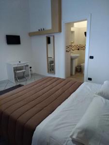 Postel nebo postele na pokoji v ubytování Al cortile