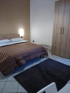 Postel nebo postele na pokoji v ubytování Al cortile