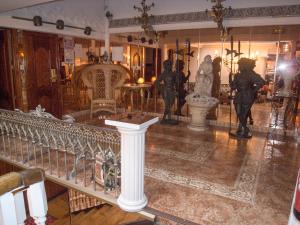a room with statues on display in a museum at Hotel Dato in Vitoria-Gasteiz