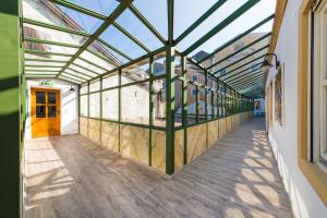 an empty hallway of a building with a glass ceiling at Hotel Mayrbräu in Braunau am Inn