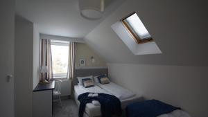 Postel nebo postele na pokoji v ubytování U Kierownika Plaży