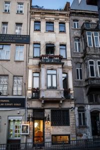 a tall building with a store in front of it at Peradays in Istanbul