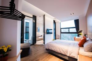 Postel nebo postele na pokoji v ubytování Galilee B&B 加利利海民宿