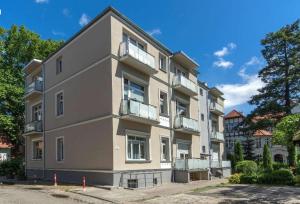 a large building with balconies on the side of it at Apartament Chopina 5 m5 - Centrum Sopotu 3 min do Monciaka in Sopot