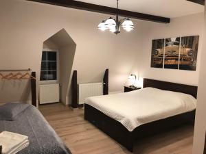 a bedroom with a bed and a couch at House 54 in Braşov