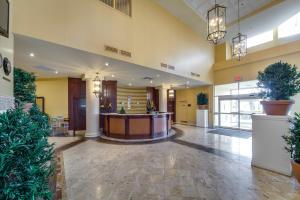 an empty lobby of a hospital with potted plants at Monte Carlo Inn & Suites Downtown Markham in Markham