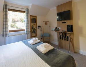 Postel nebo postele na pokoji v ubytování Bracarina House Bed & Breakfast & Caledonian Studio